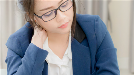 woman sitting at her desk