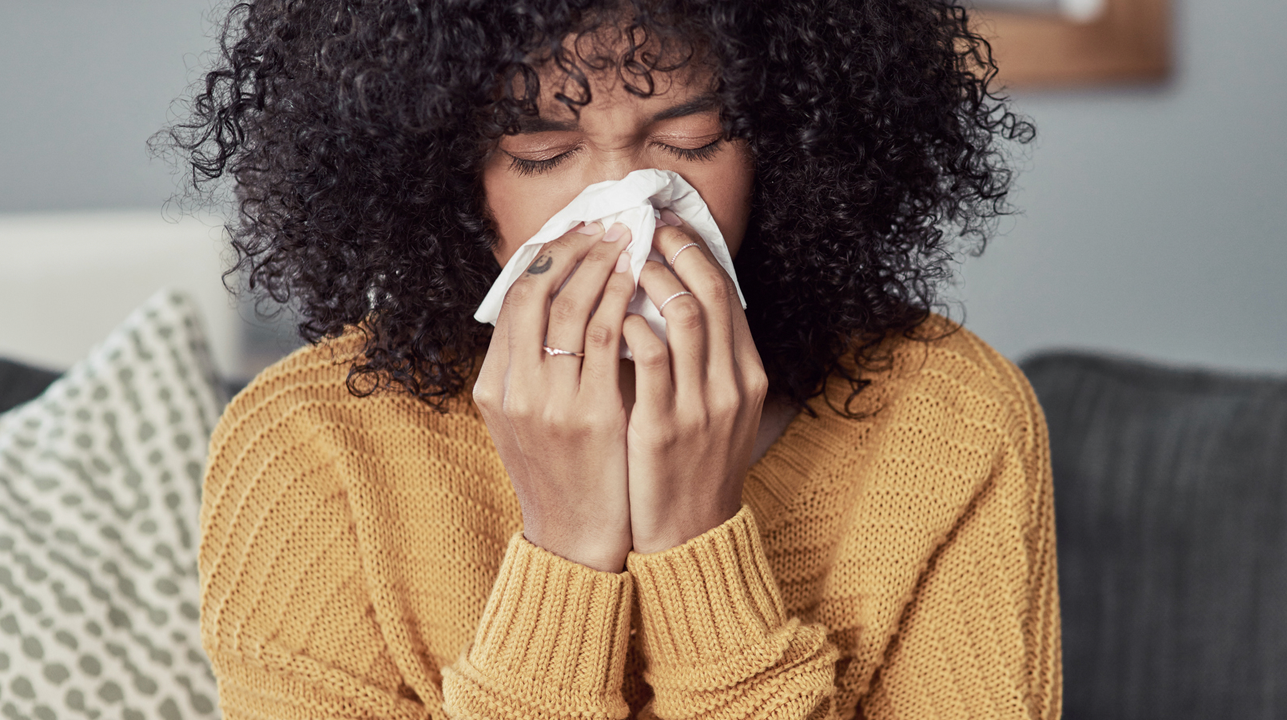  woman sneezing