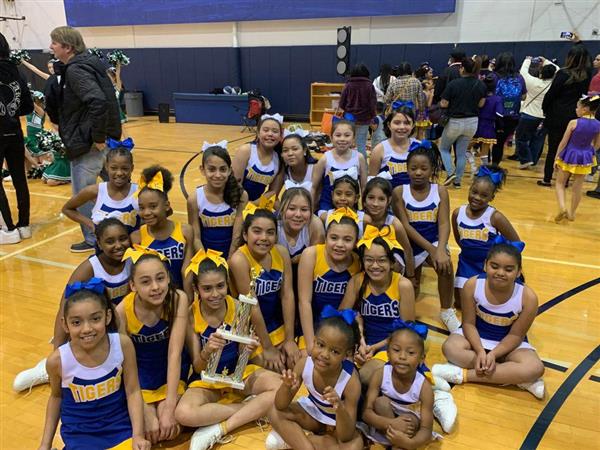 Our 22-23 Cheer Squad celebrating after winning 1st place at the Rice University Cheer Competition.